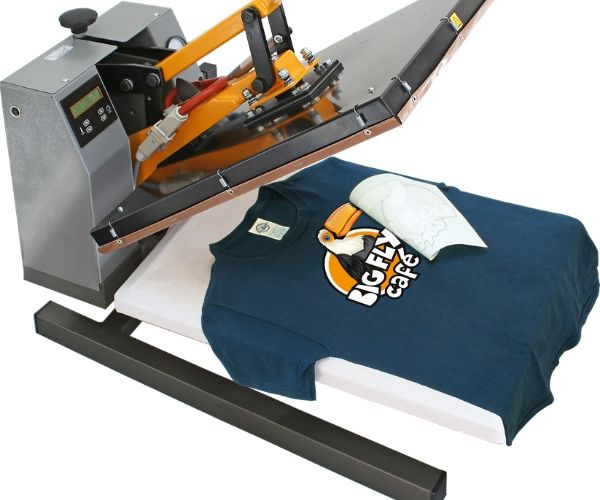 A blue t-shirt on a screen printing press.